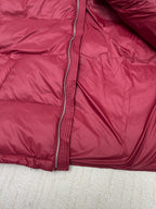 Prada red puffer jacket close-up of front zipper and inner placket