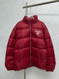 Prada red puffer jacket with front zipper and PRADA logo patch