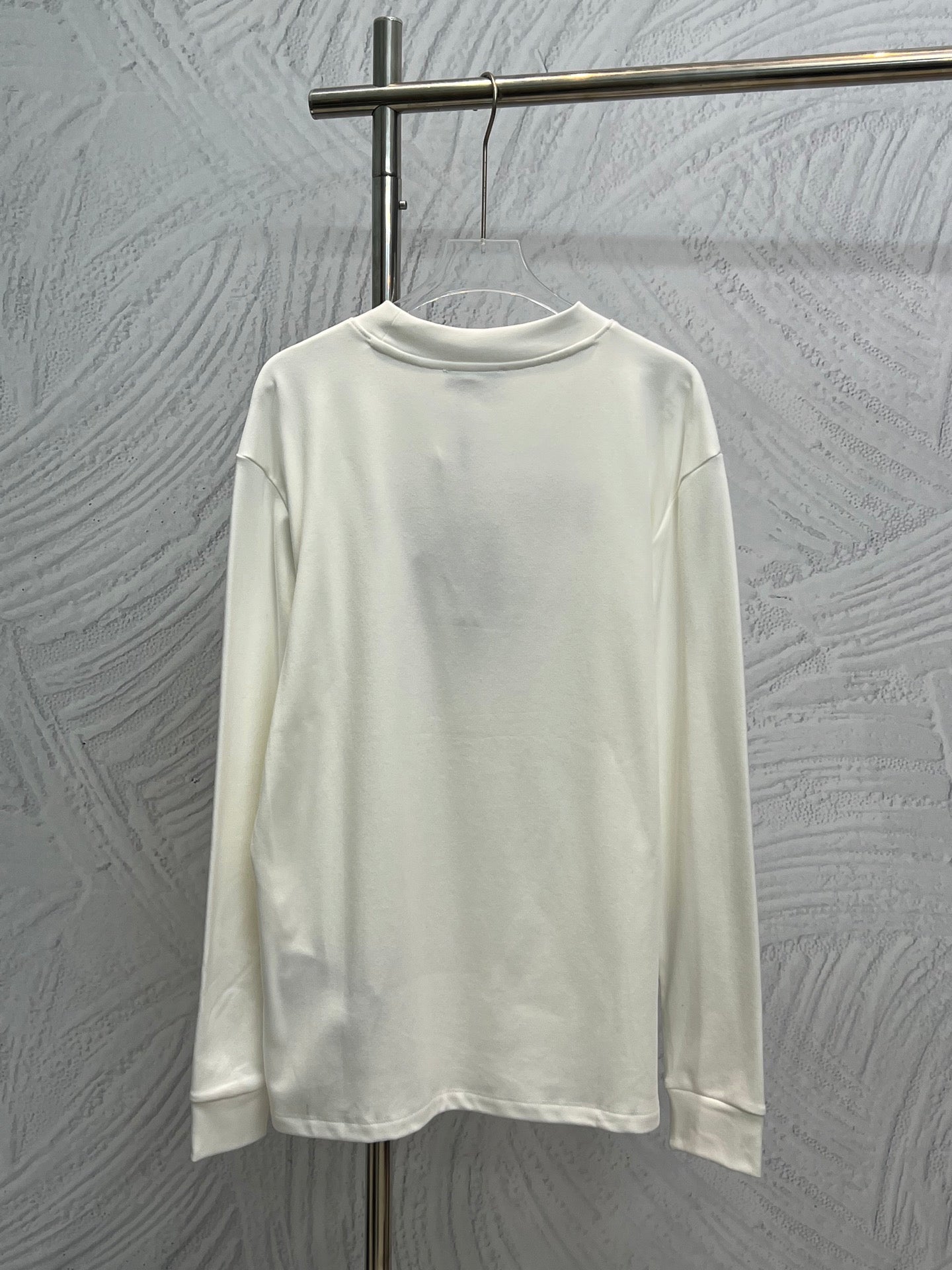White long-sleeve crewneck shirt, plain front