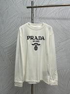 White long-sleeve crewneck shirt with PRADA MILANO logo and crest print