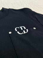 Dark sweatshirt chest logo with round snaps and pocket
