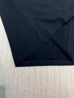 Dark sweatshirt fabric hem and side seam close-up