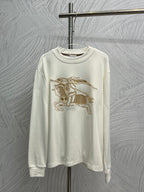 White long-sleeve shirt with gold horse graphic embroidery on the front