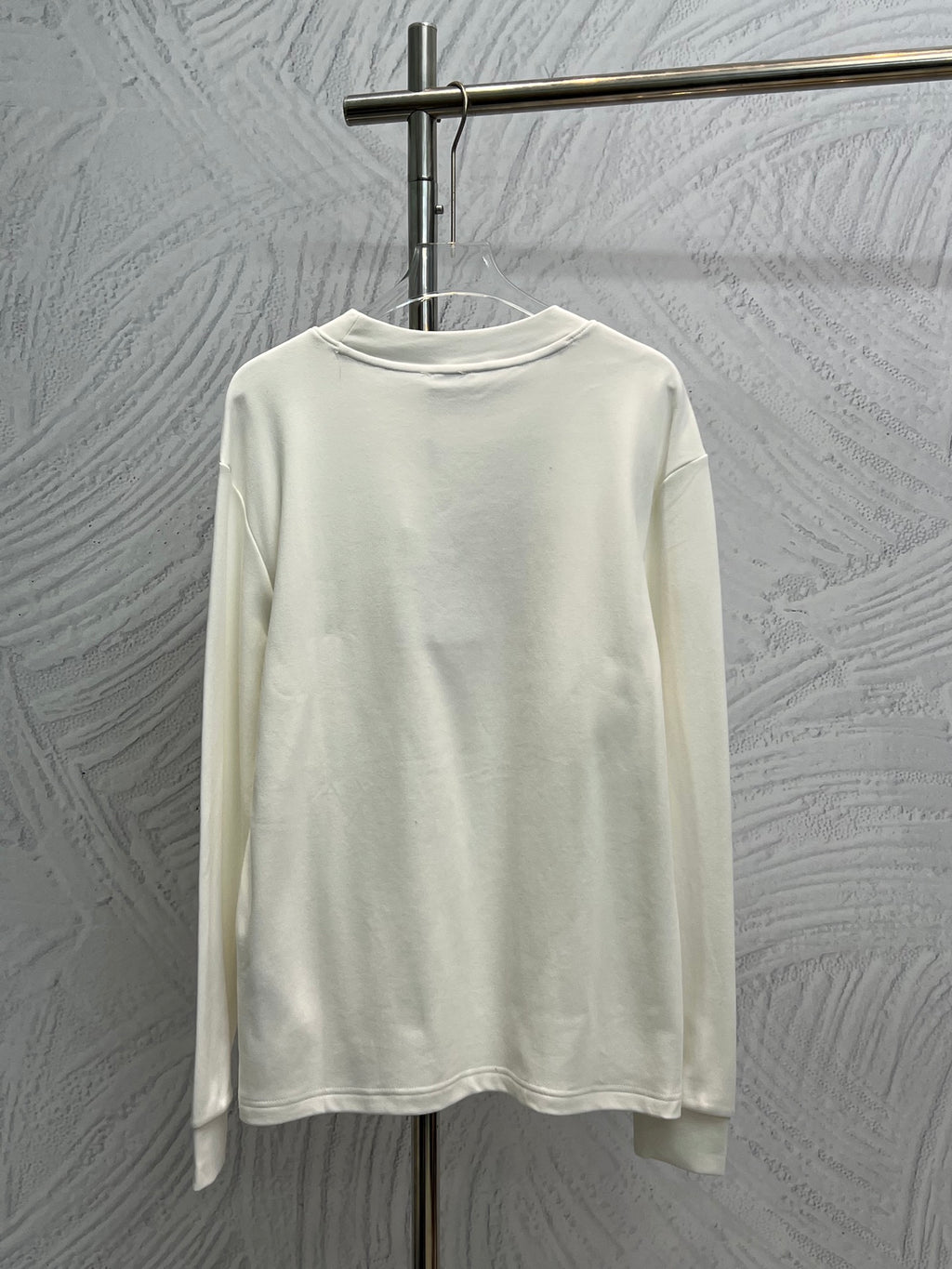 White long-sleeve shirt, plain back with ribbed crew neck