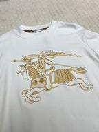 White long-sleeve shirt with large gold horse-and-rider graphic on the chest