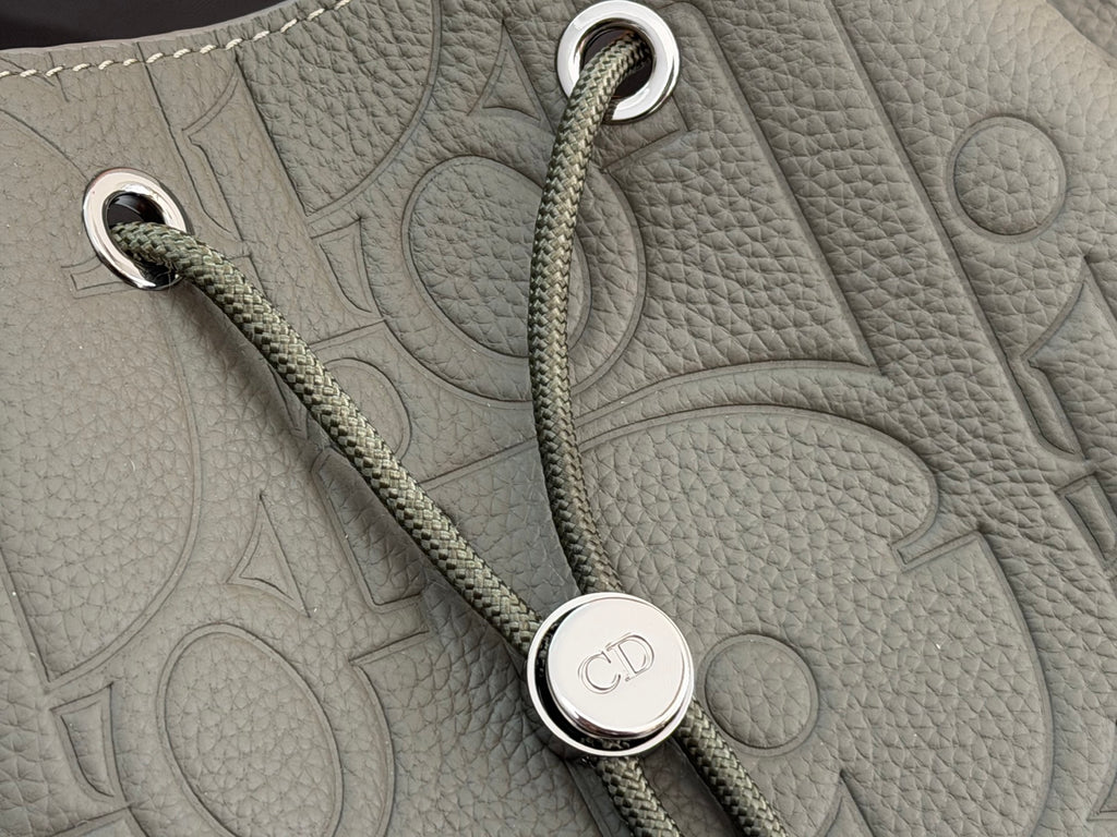 Gray leather bag with rope strap and round Dior-branded snap detail