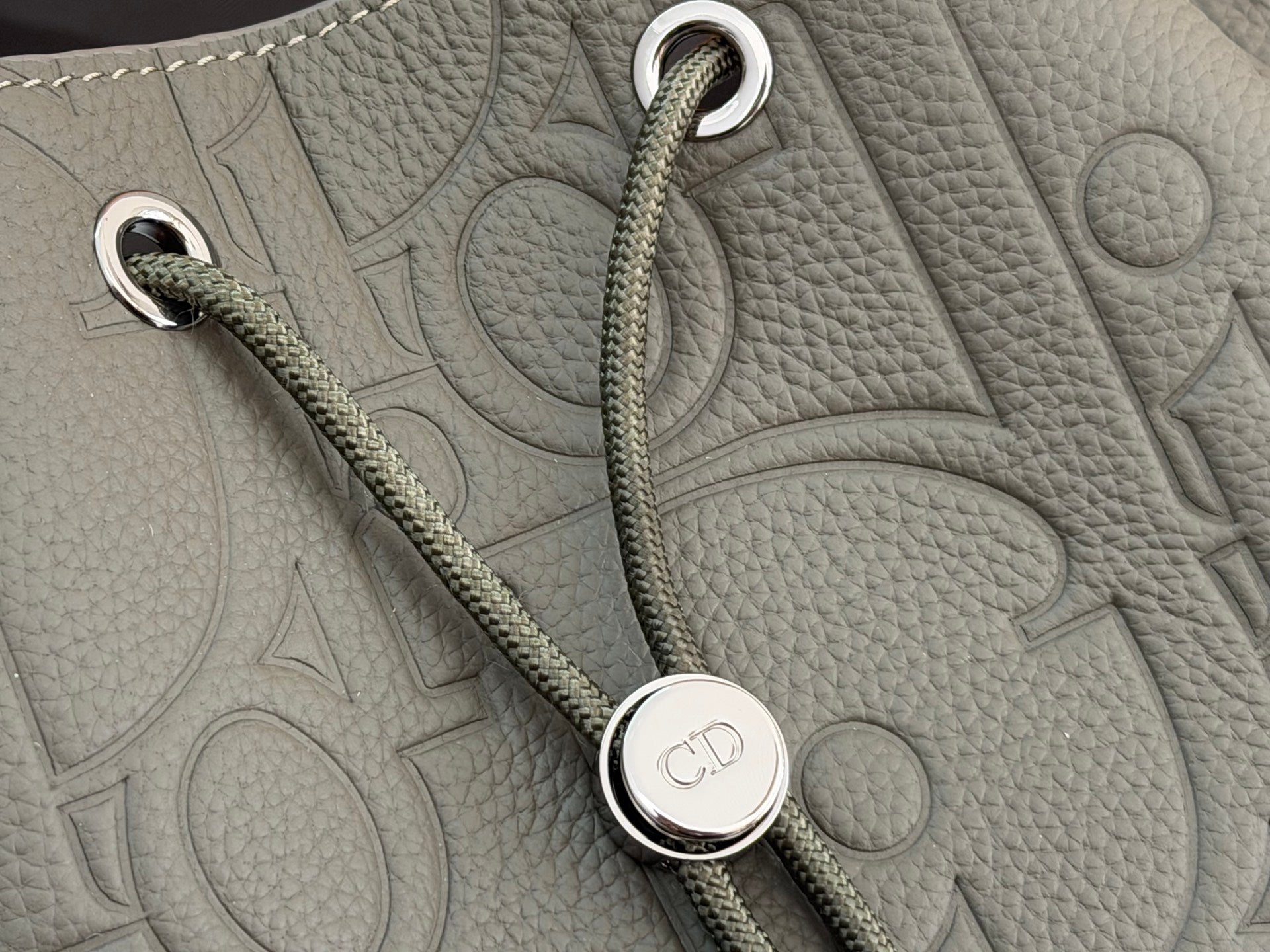 Gray leather bag with rope strap and round Dior-branded snap detail