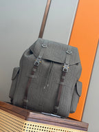 Gray Dior monogram tote bag with front flap, buckled straps, and top handle
