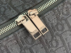 Dior men’s bag zipper with gold-tone double pull and “DIOR” labels