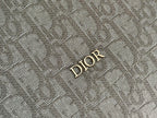 Dior Oblique fabric panel with “DIOR” logo emblem in gold tone