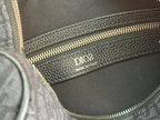 Dior logo on interior lining with gold-tone zipper detail on gray bag