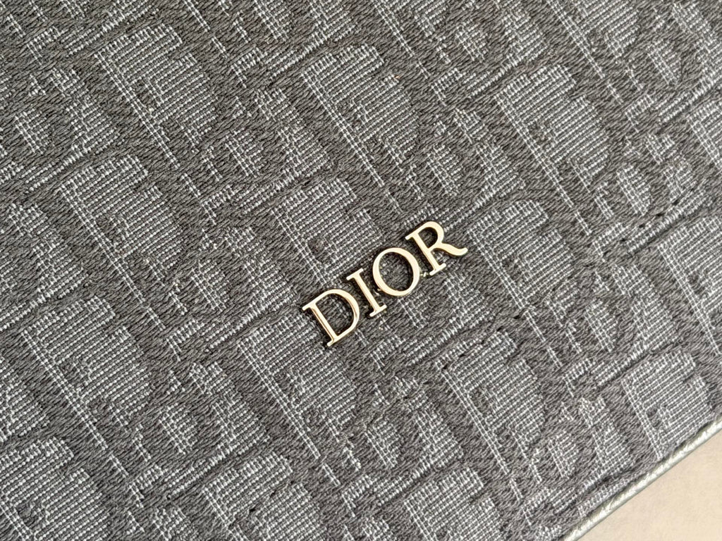 Dior monogram detail on dark blue woven fabric