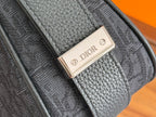 Metal Dior logo plate on textured dark blue leather strap