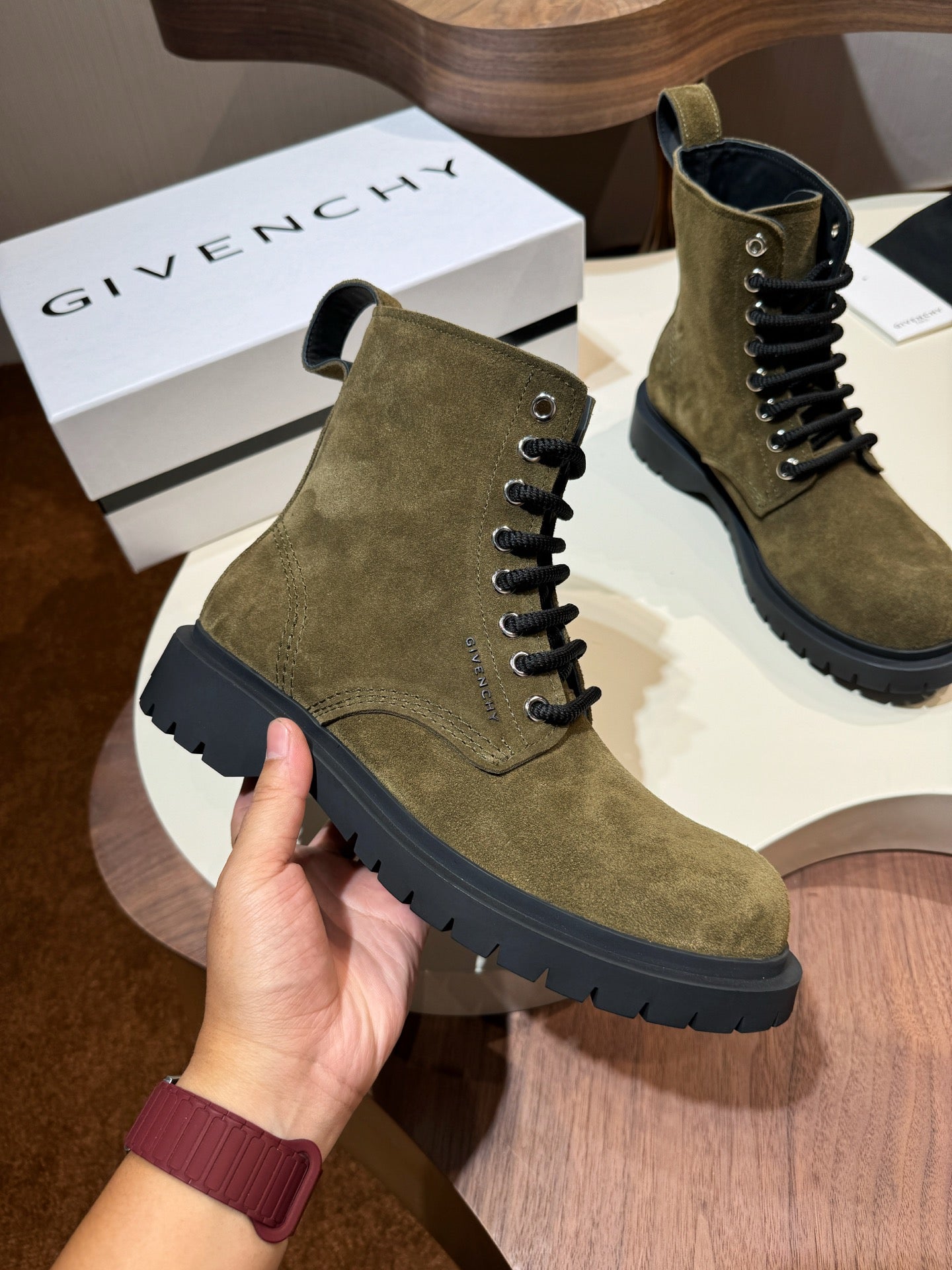 Givenchy olive suede ankle boot with black lug sole and lace-up eyelets
