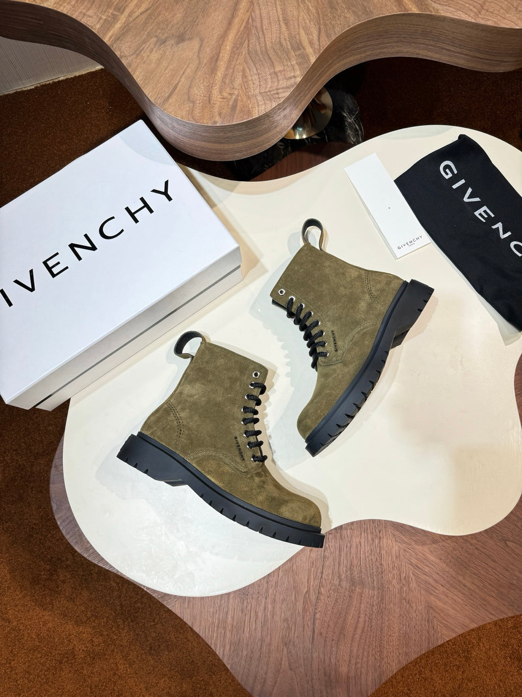 Givenchy olive suede lace-up ankle boots pair with black lug soles