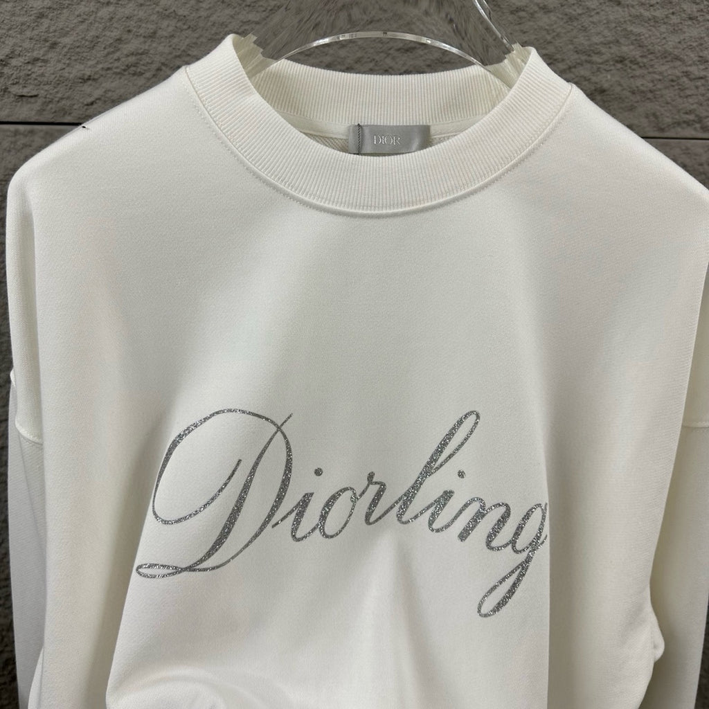 White long-sleeve sweatshirt front view with glitter “Diorling” script logo.