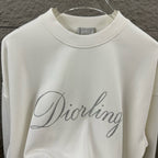 White long-sleeve sweatshirt front view with glitter “Diorling” script logo.