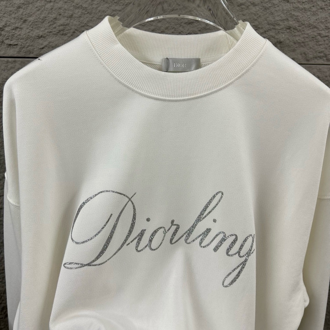 White long-sleeve sweatshirt front view with glitter “Diorling” script logo.
