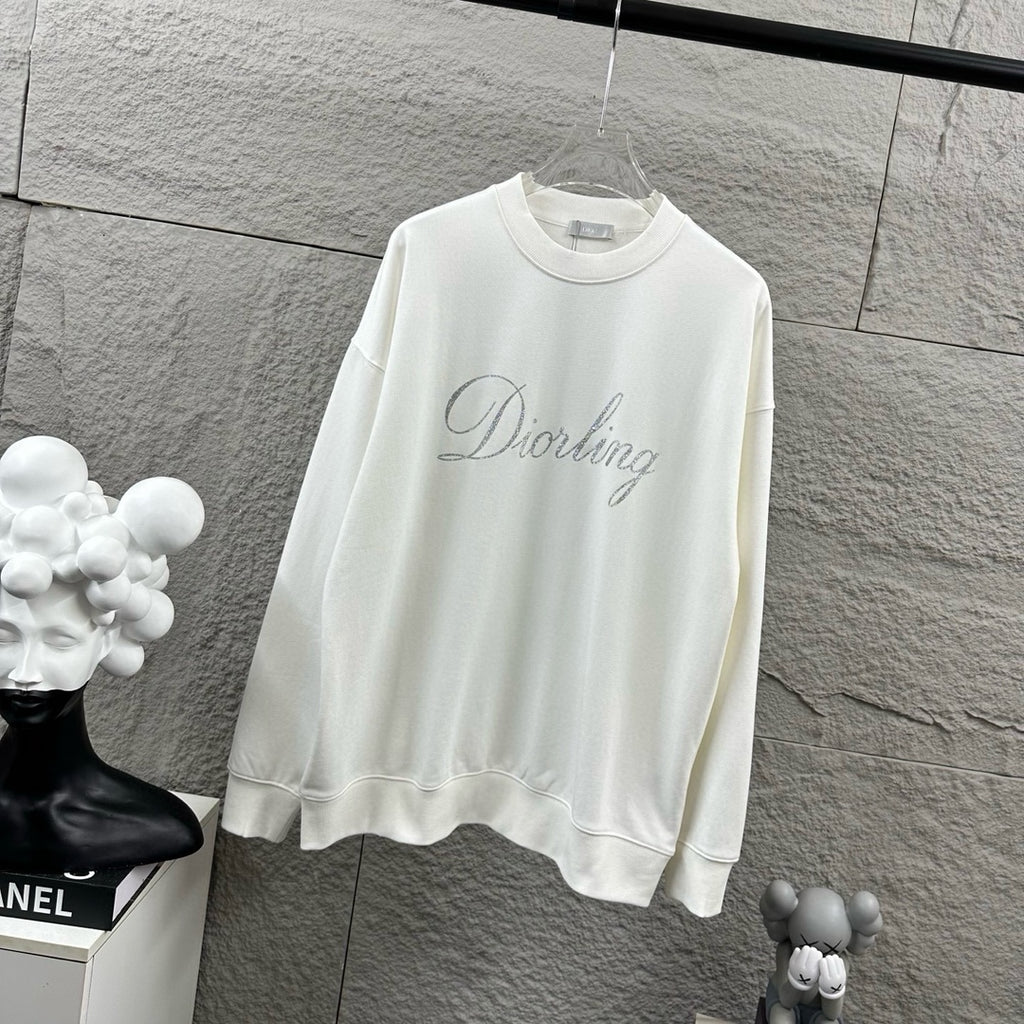 White long-sleeve sweatshirt with crew neck and glitter “Diorling” script logo.