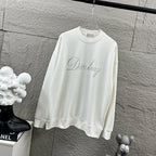 White long-sleeve sweatshirt with crew neck and glitter “Diorling” script logo.