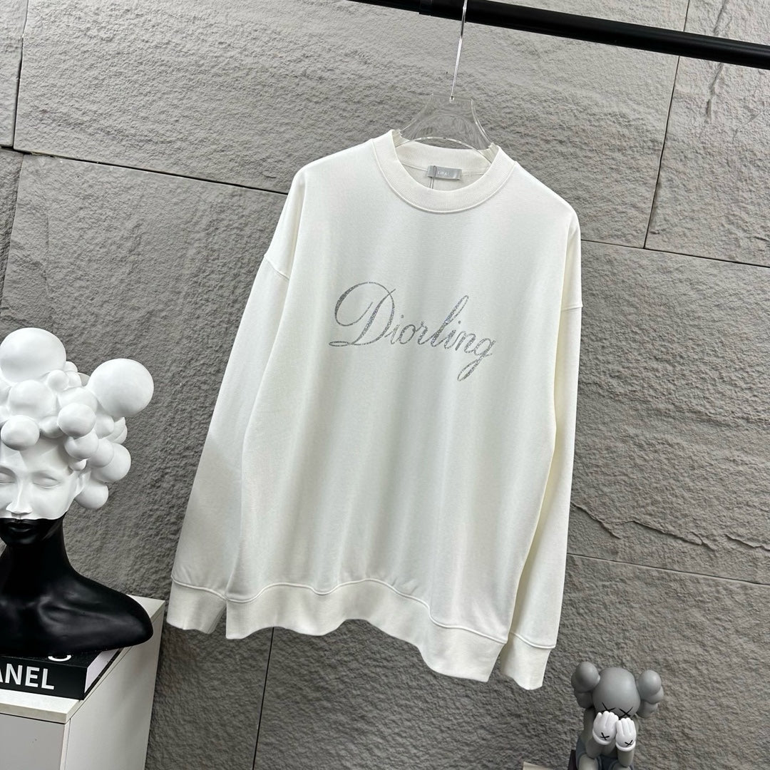 White long-sleeve sweatshirt with crew neck and glitter “Diorling” script logo.
