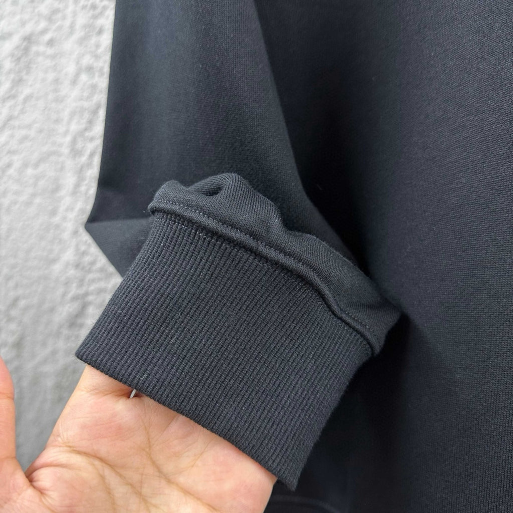 Black sweatshirt sleeve cuff with ribbed knit edge