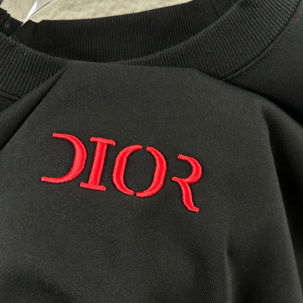 Dior sweatshirt chest logo detail, red 'DIOR' on dark knit fabric