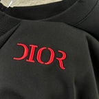 Dior sweatshirt chest logo detail, red 'DIOR' on dark knit fabric