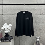Dark long-sleeve sweatshirt with Christian Dior Atelier logo on chest, front view