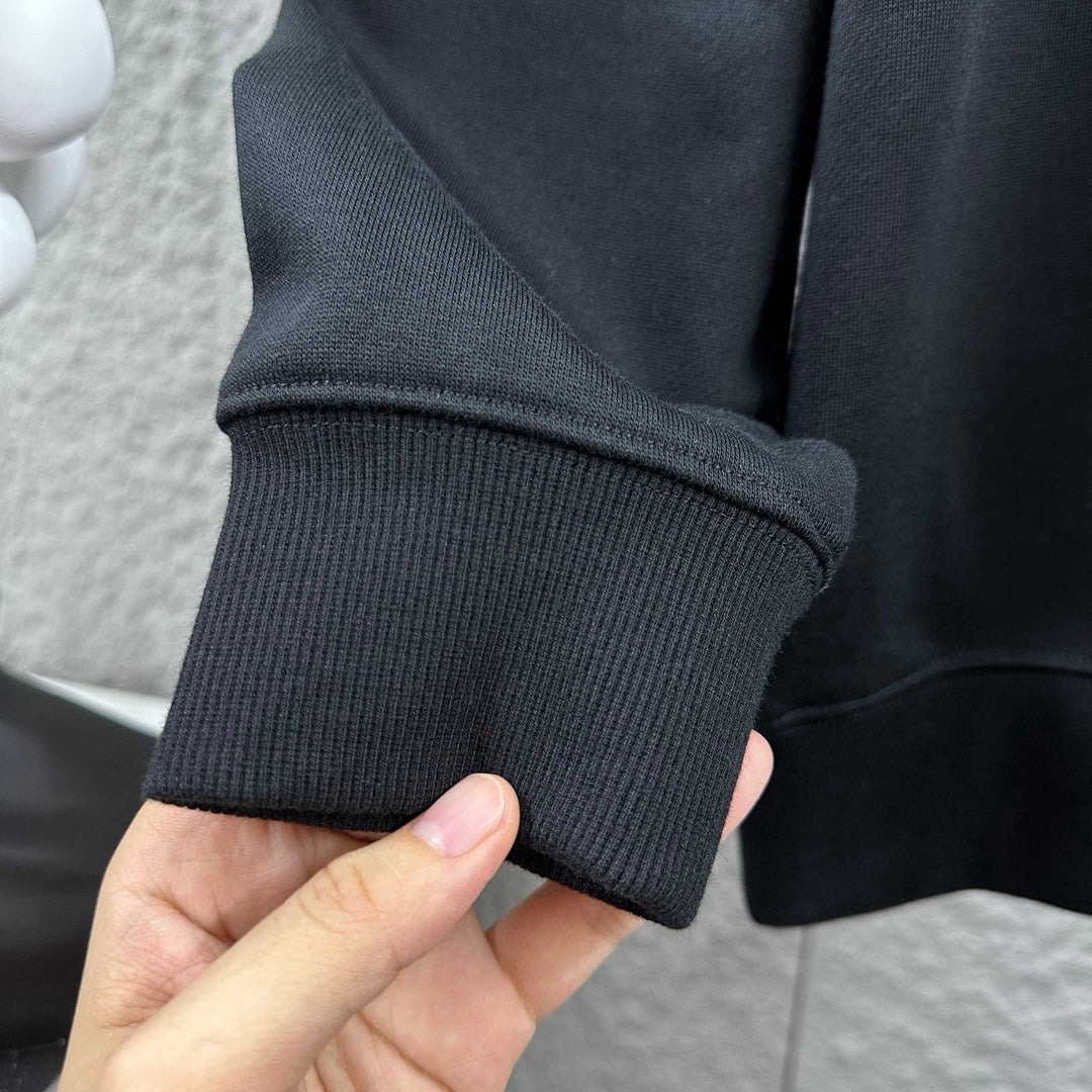Black ribbed knit cuff and sleeve end