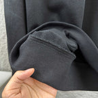 Black sweatshirt knit hem and stitched seam detail