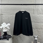 Black long-sleeve crewneck sweatshirt with small Christian Dior Couture chest logo