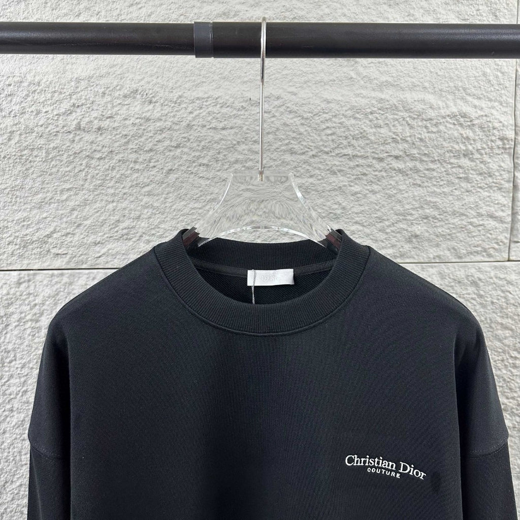 Black long-sleeve crewneck sweatshirt with small Christian Dior Couture chest logo
