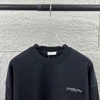 Black long-sleeve crewneck sweatshirt with small Christian Dior Couture chest logo