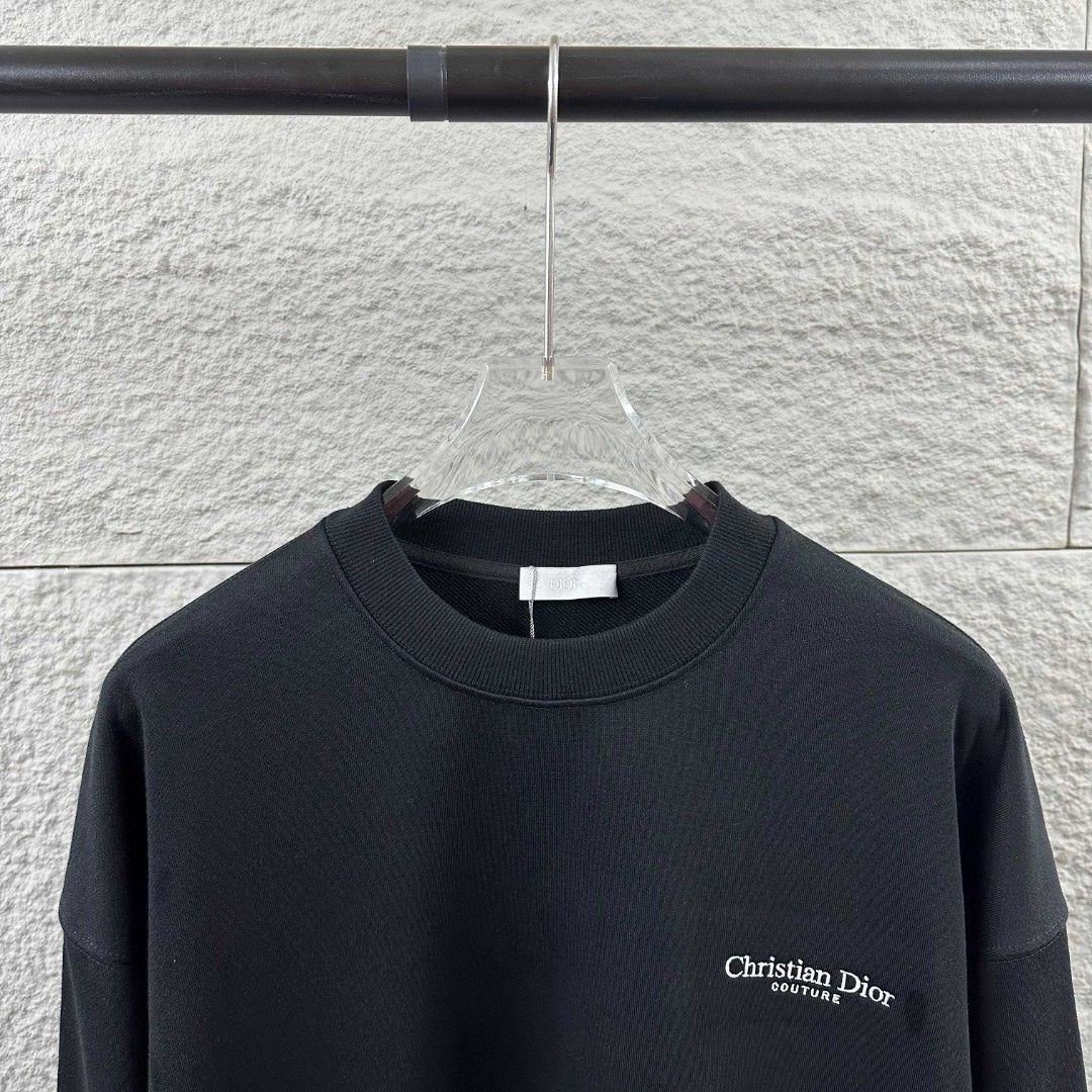Black long-sleeve crewneck sweatshirt with small Christian Dior Couture chest logo