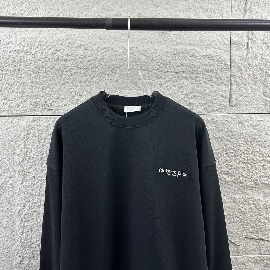 Black long-sleeve crewneck sweatshirt with small Christian Dior Couture chest logo