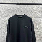 Black long-sleeve crewneck sweatshirt with small Christian Dior Couture chest logo