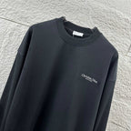 Black long-sleeve crewneck sweatshirt with small Christian Dior Couture chest print