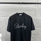 Black short-sleeve crewneck T-shirt with “Diortling” script logo at center
