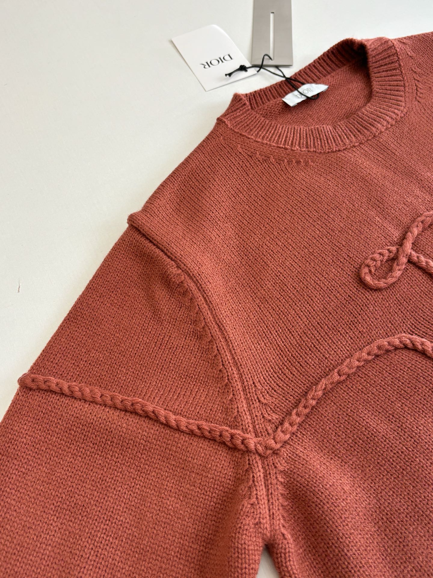 Dior knit sweater sleeve and shoulder, rust red, ribbed collar and decorative trim