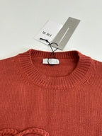 Dior knit sweater neckline, rust red ribbed crew neck with hanging tag