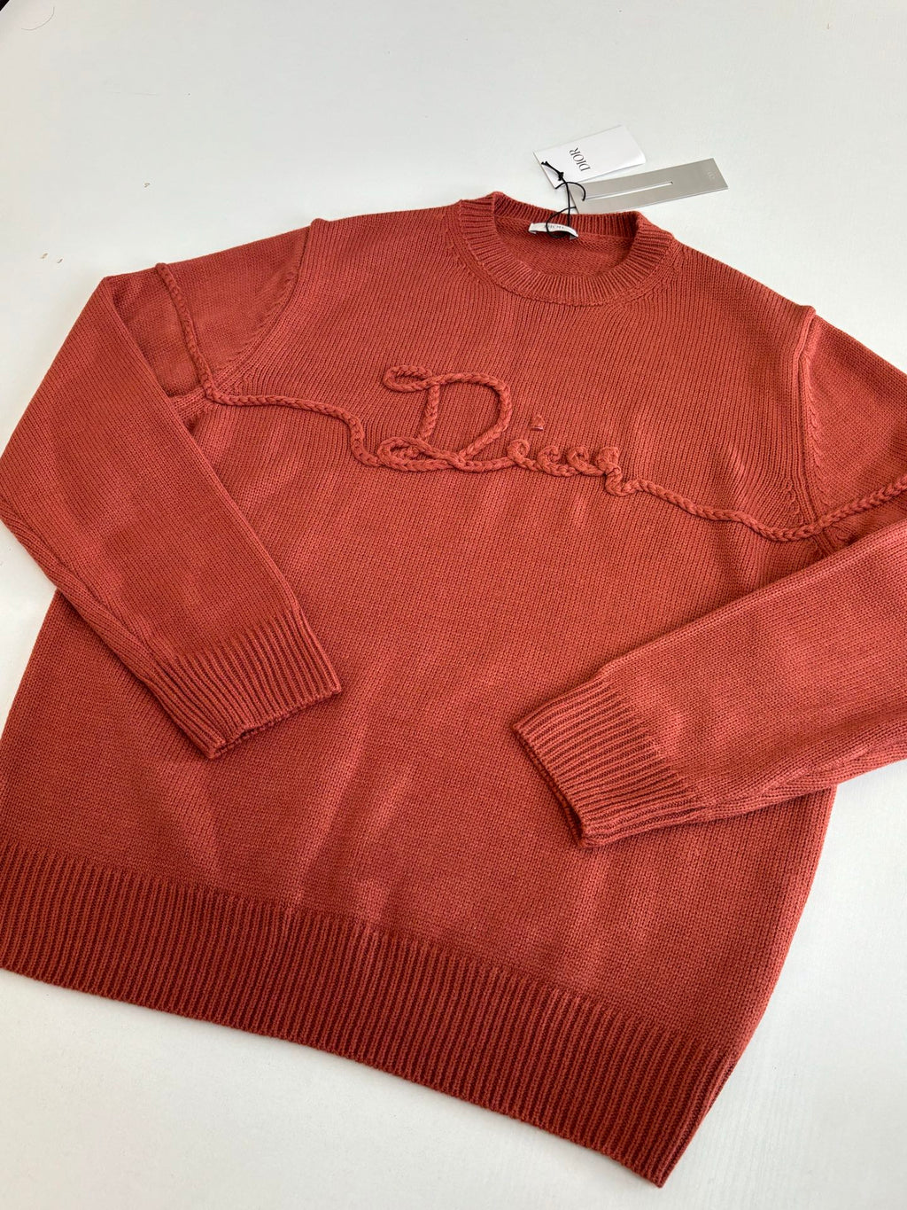 Dior knit sweater, rust red, folded flat, crew neck and embroidered logo detail
