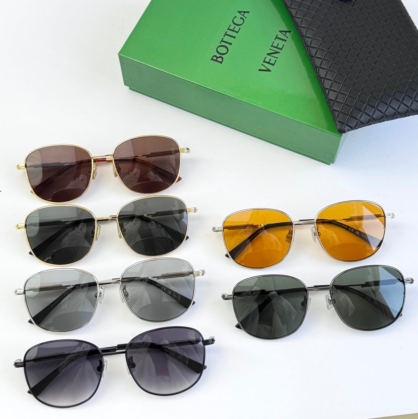 Assorted round sunglasses with multiple lens tints and metal frames