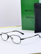 Bottega Veneta glasses with clear lenses and dark frames, side angle