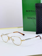 Bottega Veneta glasses with gold frames, tortoise arms, brown tinted lenses