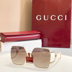 Gucci sunglasses with square gradient lenses and gold-tone frames, clear beige tones