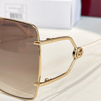 Gucci sunglasses close-up: gold-tone square frame with hinge and side detailing