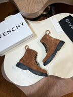 Givenchy brown suede lace-up ankle boots on round display table