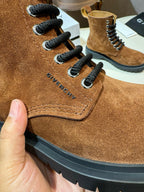 Givenchy brown suede lace-up boot close-up with black laces and side stitching
