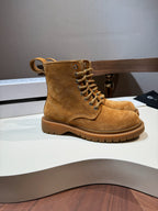 Tan suede lace-up ankle boots with thick lug sole